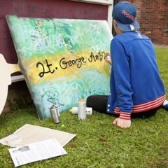An artist working on a panel